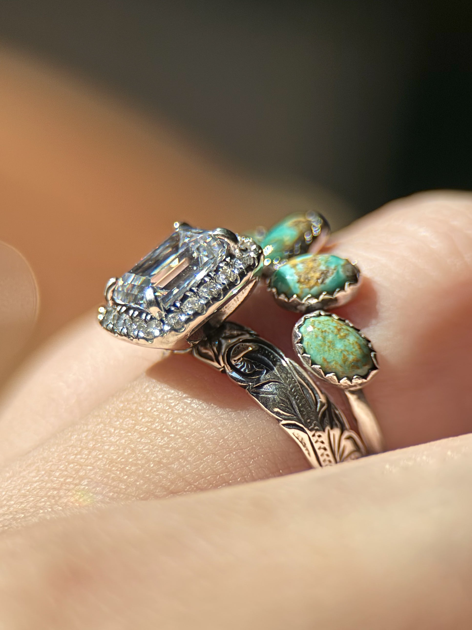 EMERALD HALO ENGAGEMENT RING.