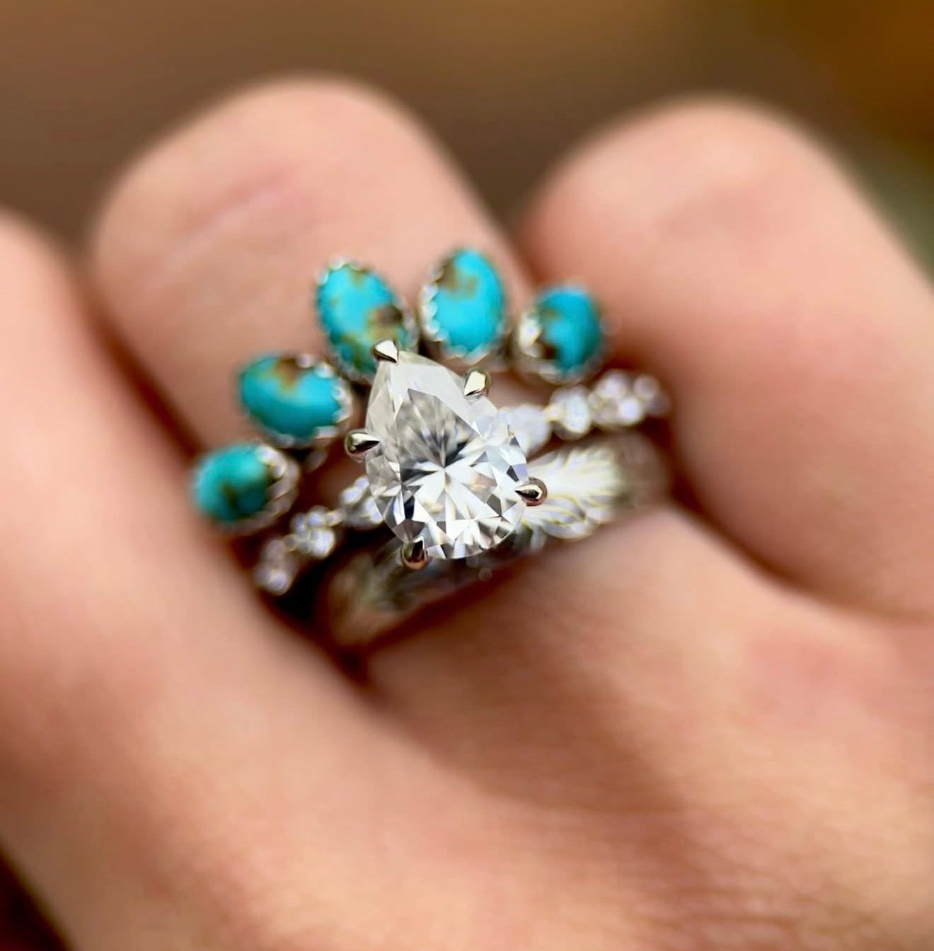 14K WHITE GOLD FANCY PEAR HIDDEN HALO SET.