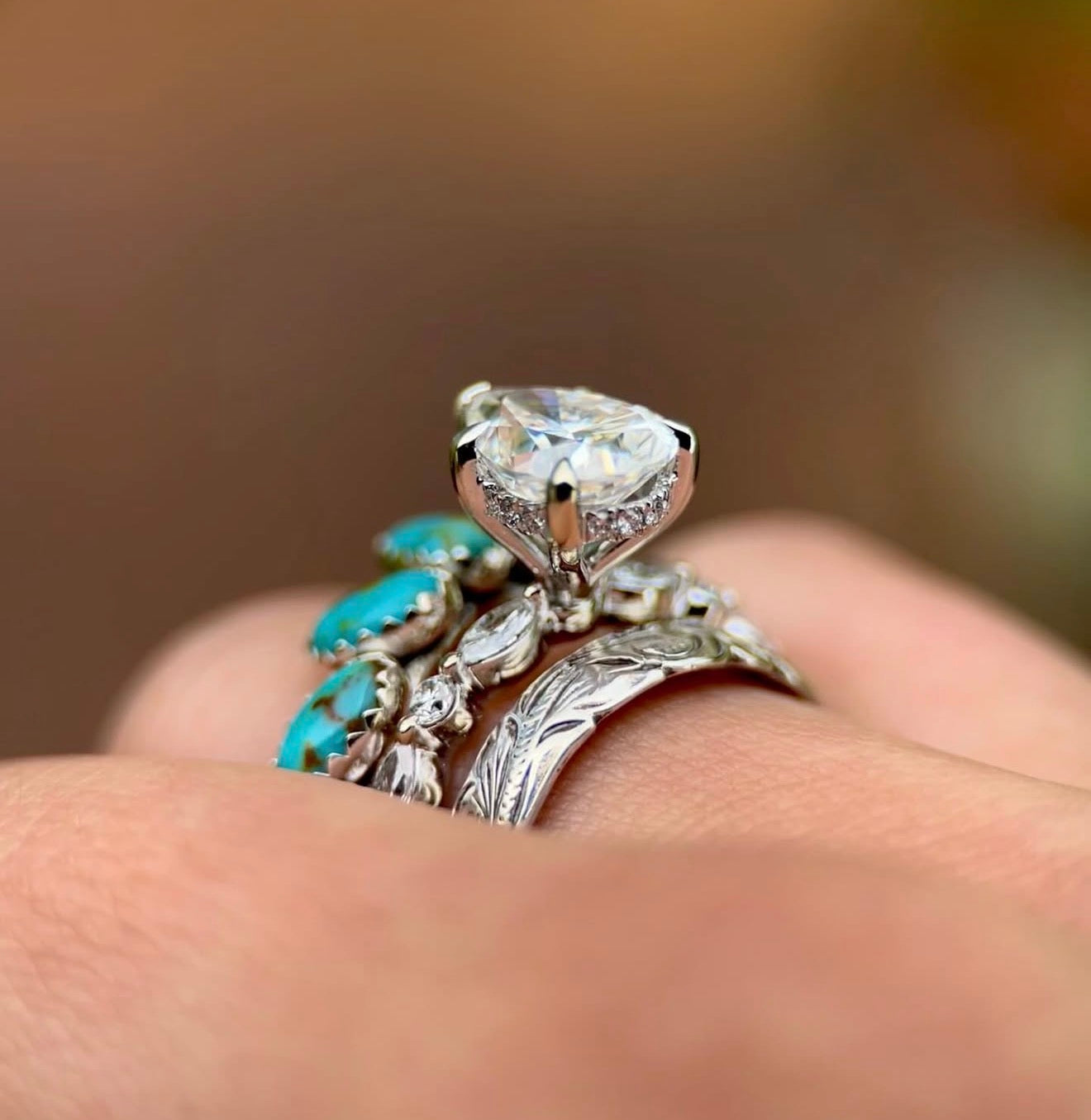 14K WHITE GOLD FANCY PEAR HIDDEN HALO SET.