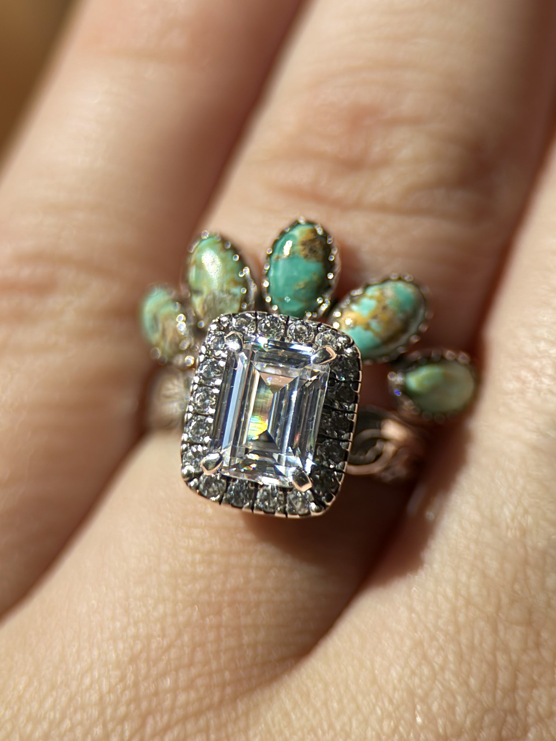 EMERALD HALO ENGAGEMENT RING.